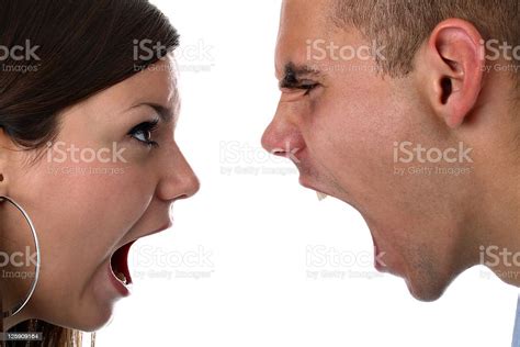 Young Couple Yelling At Each Other Isolated On White Stock Photo