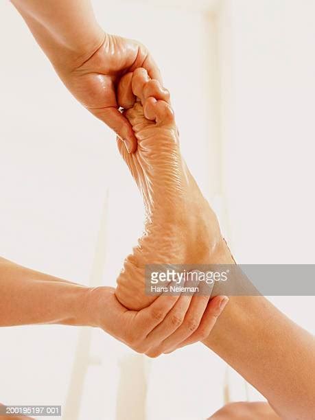 Massaging Womans Feet Photos And Premium High Res Pictures Getty Images
