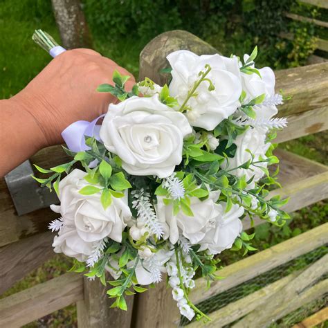 A Wedding Bouquet Collection Of Foam Roses And Lily Of The Valley Flower