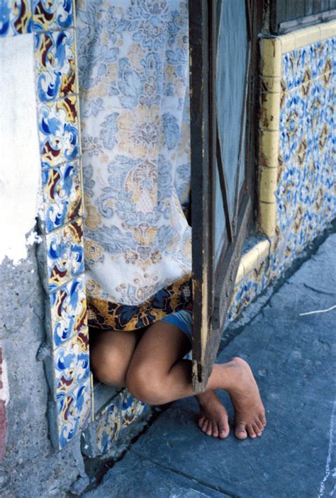 girl hiding in doorway photograph by mark goebel fine art america