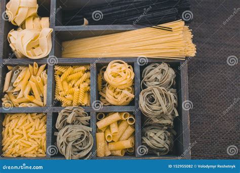 Top View Various Types Of Italian Pasta In A Wooden Box With Different