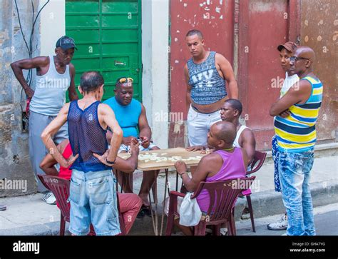 Unidentified Men Play Domino On The Street In Havana Cuba Stock Photo