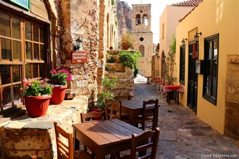 Tables Of Tavernas In The Fortified Town In The Morning Photo