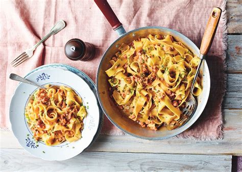 Put the butter, onion and sausage into a large pan. Smoked sausage pasta recipe