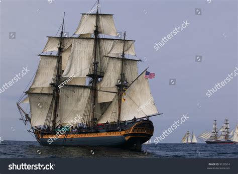 Vintage Frigate Sailing Ship At Sea Under Full Sail With Tall Ships In