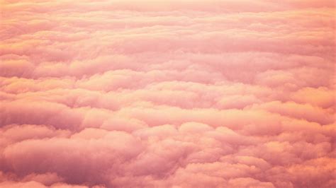 Beautiful mesmerizing picturesque epic drone footage from air of purple pink sunset, clouds and sun on horizon, high tide waves crush on shore of jungle forest mountains. Download wallpaper 2048x1152 clouds, beautiful, sky, sunset, pink ultrawide monitor hd background