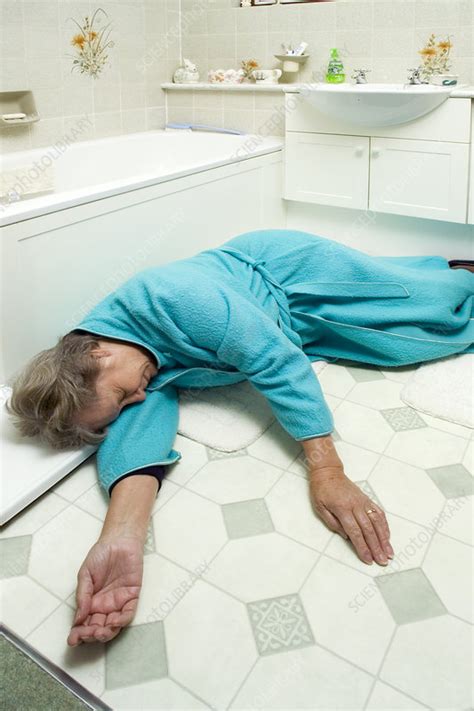 Elderly woman injured by falling - Stock Image - M340/0487 - Science 