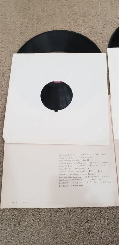 In the case of help! What is the value of a BEATLES - WHITE ALBUM; 1968; #swbo 101 WITH THE ARTWORK?