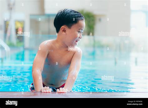 Young Boy Kid Child Eight Years Old In Swimming Pool Having Fun Leisure