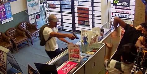 video cellphone store employees wrestle with gun wielding robber cbs news