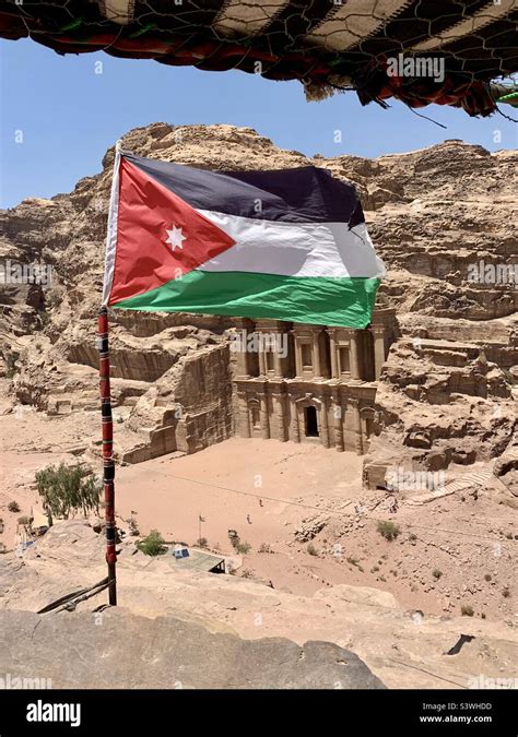 Jordanian Flag Flying Over Monastery In Petra Jordan Stock Photo Alamy