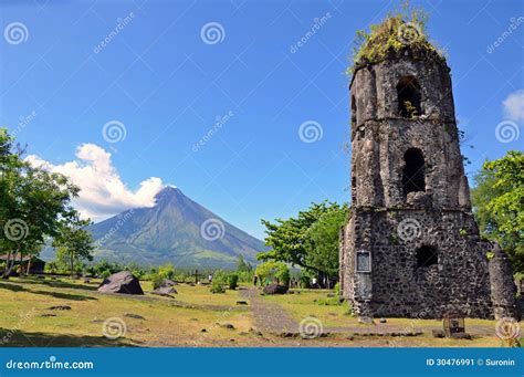 The Ruins Of Cagsawa Church Showing Mount Mayon Erupting In The