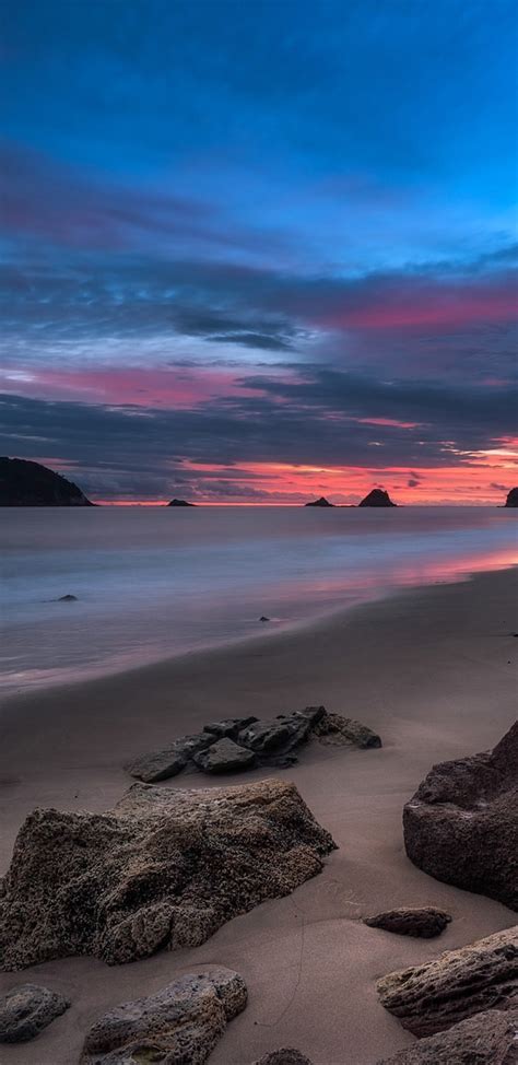 Download 1440x2960 Ocean Beach Rocks Horizon Sunset Wallpapers For