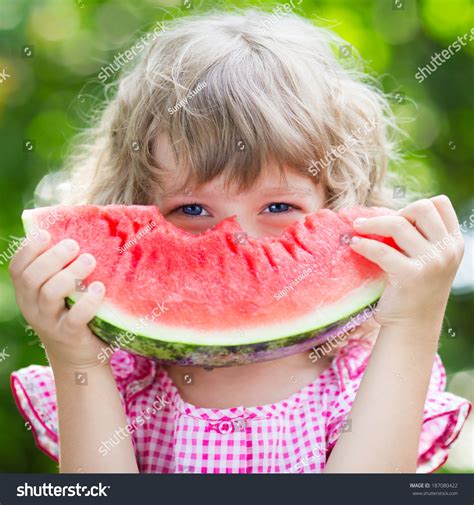 Funny Kid Eating Watermelon Outdoors In Summer Park Child Baby