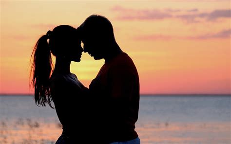 hd wallpaper sea girl sunset passion kiss hugs pair male lovers wallpaper flare