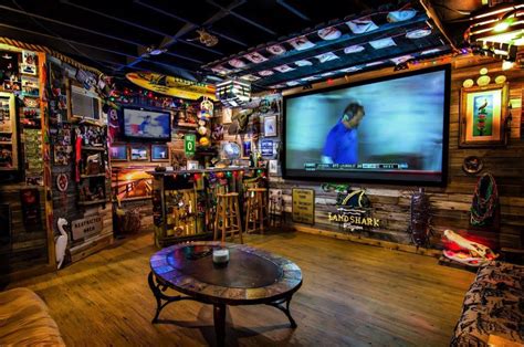 a man cave should be filled to the brim with all the things a man loves and a big ass tv