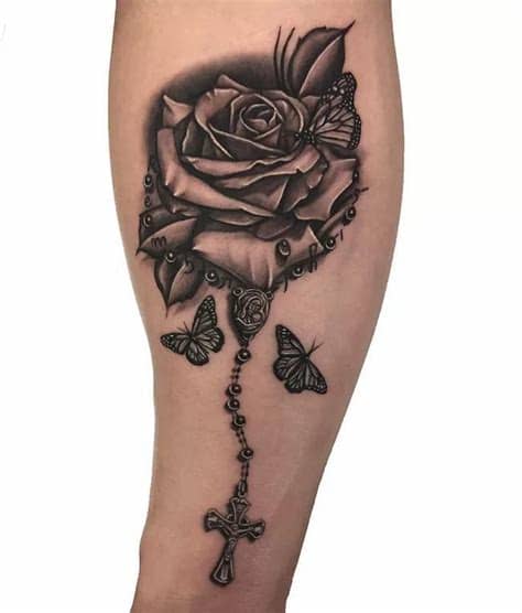 Rose, rosary and butterfly tattoo done by Martin # ...