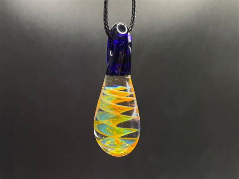 Borosilicate Glass Pendant With Thick Silver Fume Spiral In Tear Drop Shape With Blue Glass Bail