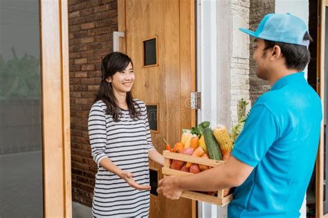 Smiling Woman Receiving Grocery Delivery At Home Stock Photo Image Of