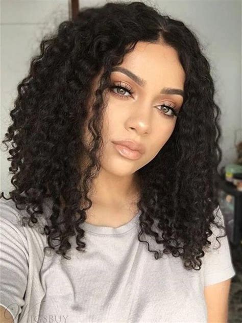 It will smoothly form an oval shape of the face, emphasize the length of the neck and the beauty of the shoulders. Fashionable girl's medium small curly black hair