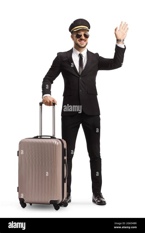 Full Length Portrait Of A Pilot Posing With A Suitcase And Waving