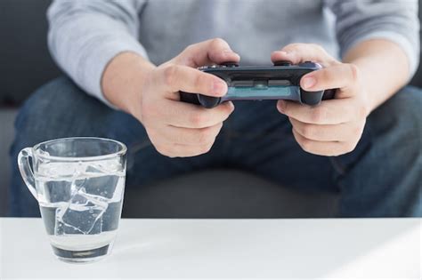 Free Photo A Young Man Holding Game Controller Playing Video Games