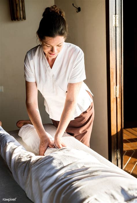 Female Massage Therapist Giving A Massage At A Spa Premium Image By Jira