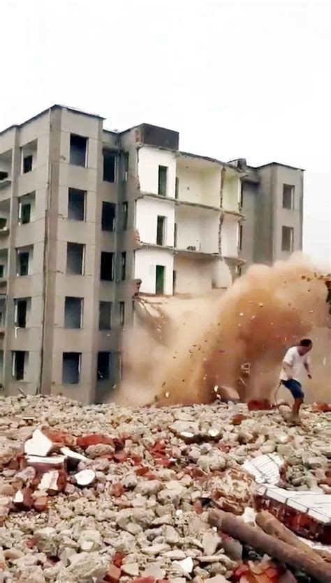 Dramatic Moment A Man Runs For His Life As A Falling Building Collapses