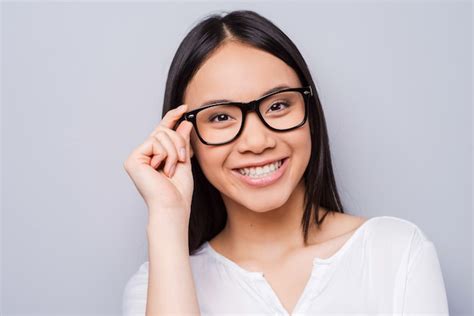 Premium Photo Smart And Beautiful Beautiful Young Asian Woman Adjusting Her Eyewear And