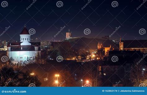 Vilnius City Illuminated At Night View From Bastion Hill Stock Photo
