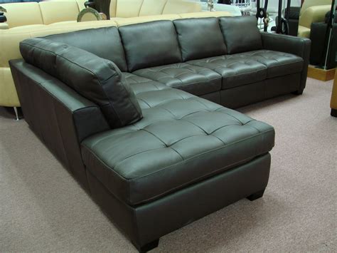 Features a camelback and flared arms over bun feet. Natuzzi Leather Sofas & Sectionals by Interior Concepts ...