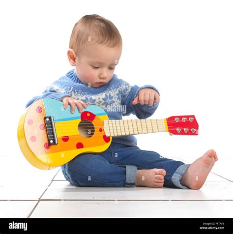 Baby Boy 125 Months Sitting Playing Toy Guitar Stock Photo Alamy