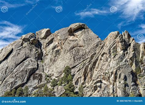 Upward View Of The Rock Formations Towering Above The Backyard Boulders