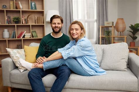 Romantic Couple Embracing Sofa Happy Couple Relaxing On Couch At Home Stock Image Image Of