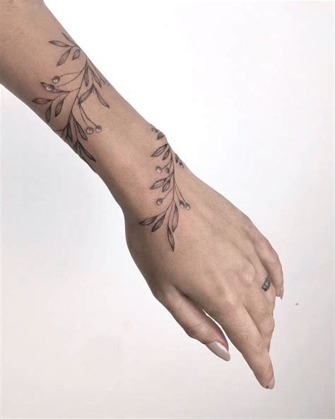 pin by jessika mazurkewich on tattoos tattoos wrap around wrist tattoos wrap around tattoo