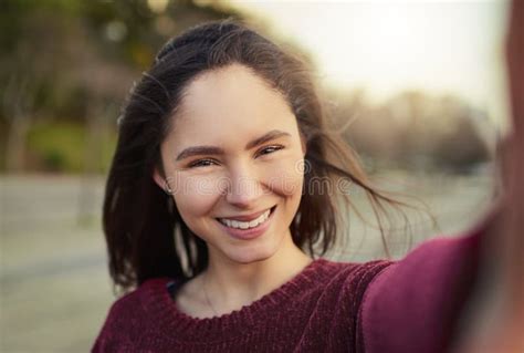 But First A Selfie Portrait Of A Happy Young Woman Taking A Selfie Outdoors Stock Image