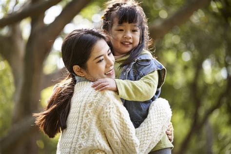 Asian Mother And Daughter Hugging Outdoors Stock Image Image Of