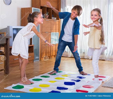 Children Playing Twister At Home Stock Photography
