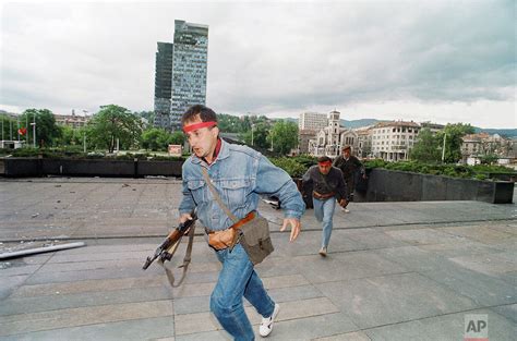 Bosnian Fighters Run Towards One Of Their Positions Friday June 12