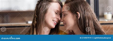 Panoramic Shot Of Two Smiling Lesbians In Living Room Stock Image Image Of Couple Love