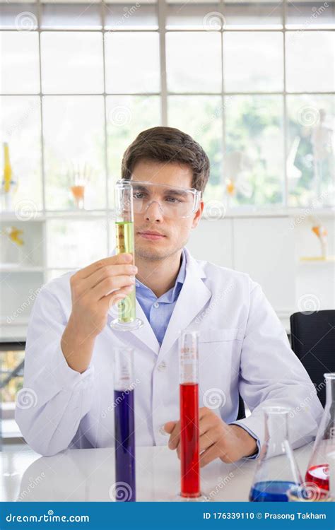 Male Scientist Working In A Science Lab With Various Equipment In The