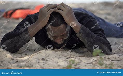 Desperate Afro American Man Crying On Shore Victim Of Crash Natural