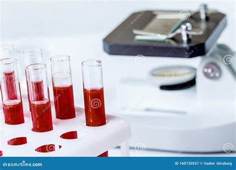 Blood In Glass Tubes On Background Of Microscope Stock Image Image Of