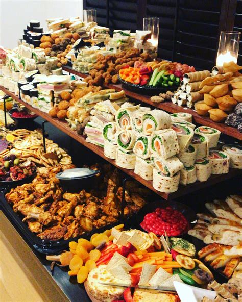 Appetizer Table Sandwiches Roll Ups Wings Veggies Fruits Party