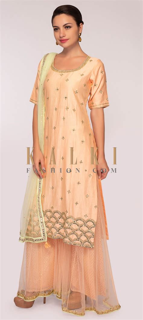 Powder Pink Suit Paired With Weaved Palazzo Pant With Net Top Layer Only On Kalki