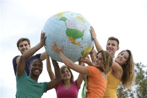 Group Of Young People Holding A Globe Earth Stock Photo Image Of
