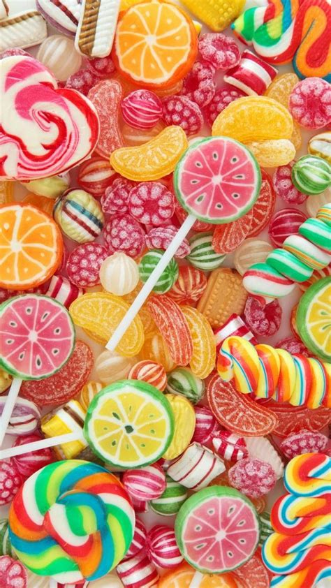 Colorful Candies And Lollipops Are Arranged In The Shape Of Fruit Slices