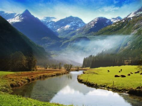 Snowy Mountain Behind The Green Mountains With River And Grass Field Hd