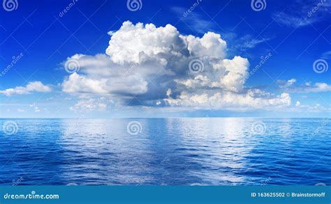 White Cumulus Clouds In Blue Sky Over Sea Landscape Big Cloud Above
