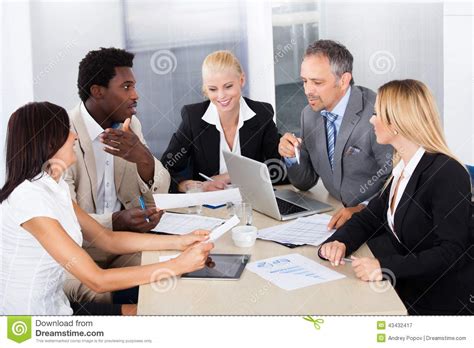 Group Of Businesspeople Discussing Together Stock Image Image Of